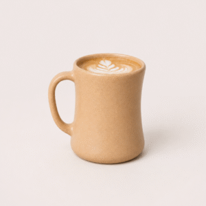 Bamboo Travel Coffee Mug in sandy brown matte finish on a wooden table